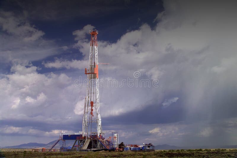 Oil Drilling Rig with Blue Sky Background. oklahoma texas louisiana. Oil Drilling Rig with Blue Sky Background. oklahoma texas louisiana