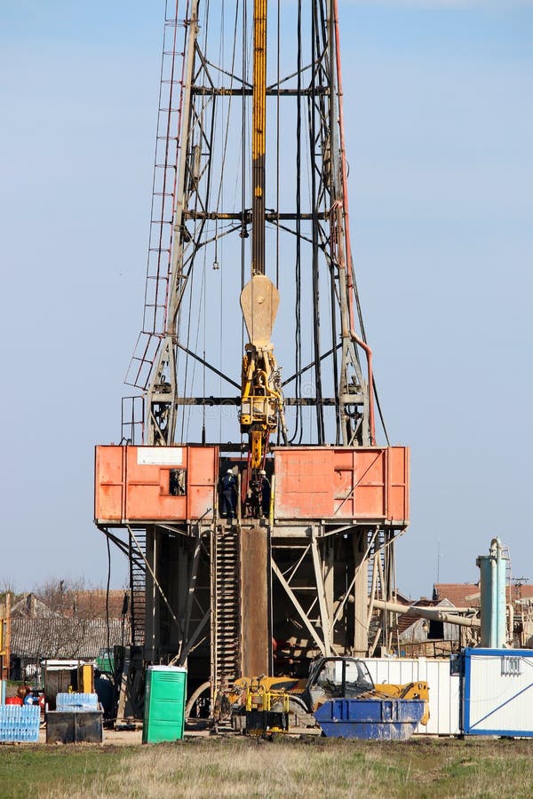Oilfield with Workers and Oil Drilling Rig Stock Photo Image of