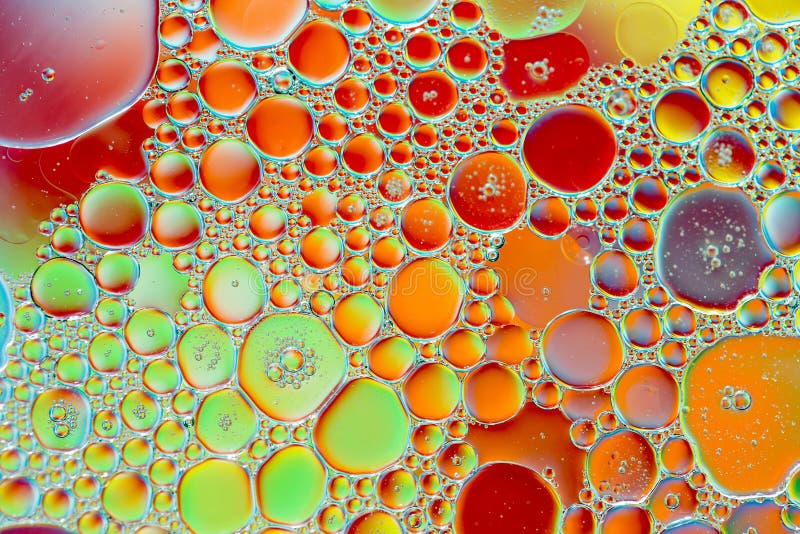 Oil Drops in Water on a Coloured Background Stock Photo Image of