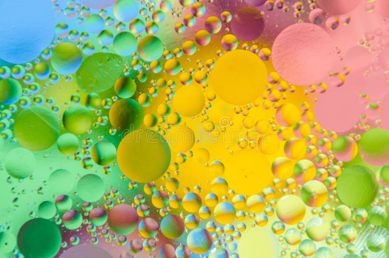 Oil drops on water surface stock photo. Image of rain 127415012