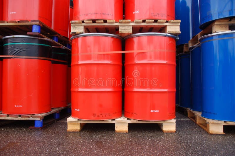 Red and blue oil drums on wooden pallets. Metal steel drum stock images, royalty-free photos and pictures