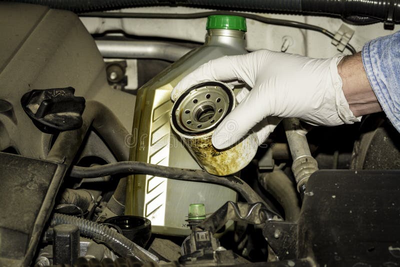 Oil Filter and Bottle in the Engine Compartment Stock Image Image of