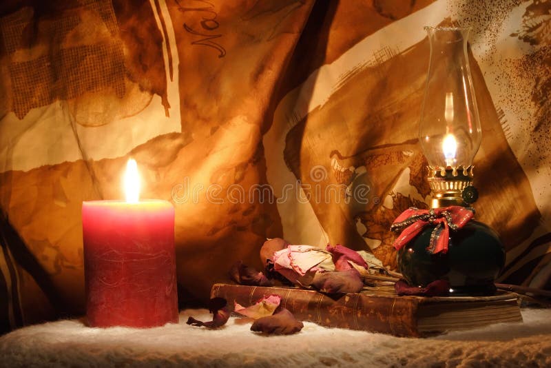 Oil Lamp, Candle and an Old Book Stock Image Image of dried, roses
