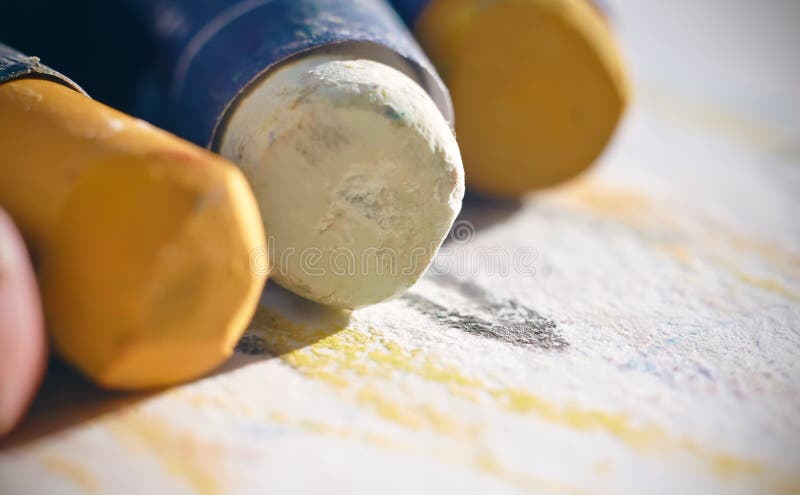 Oil pastel of different colors lying on paper for drawing stock images Oil pastel of different colors lying on paper for drawing stock images