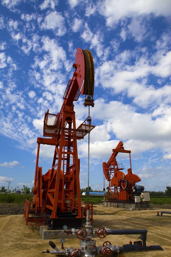 Oil pump jack stock image. Image of blue, extraction 34161301