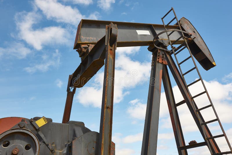 Oil Pumping Machine. Pump Jack. Petroleum Extraction. Global Warming