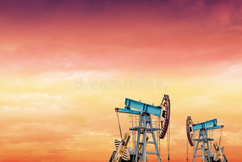 Oil pumps at sunset stock photo. Image of crisis, drilling 94198438