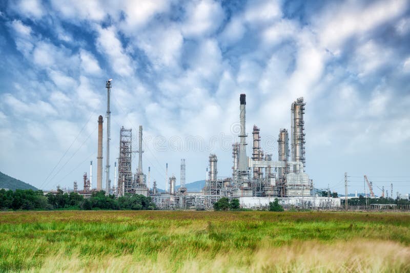 Oil refinery along daytime with blue sky