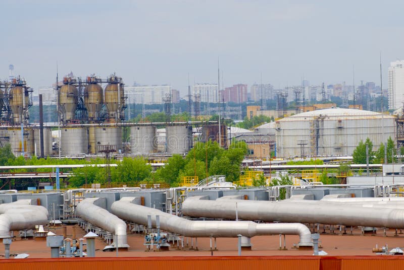 Oil factory daytime panorama. Oil refinery plant. Oil factory daytime panorama. Oil refinery plant