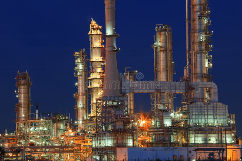 Oil refinery plant in petrochemical industry estate at night tim royalty free stock photo Oil refinery plant in petrochemical industry estate at night tim royalty free stock photo
