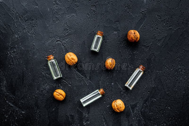 Oil for Skin Care. Walnut Oil on Black Background Top View Stock Image