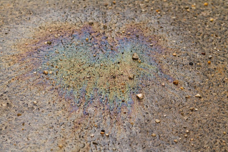 Spilled Oil on the Green Grass. Oil Leak and Nature Killed by Toxic