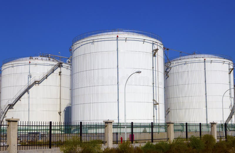 Oil and gas storage tanks stock photo. Image of coast 20902750