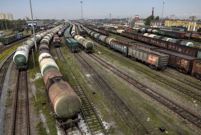 Oil tank and trains on railroad tracks, classification yard, Russia. stock photo Oil tank and trains on railroad tracks, classification yard, Russia. stock photo