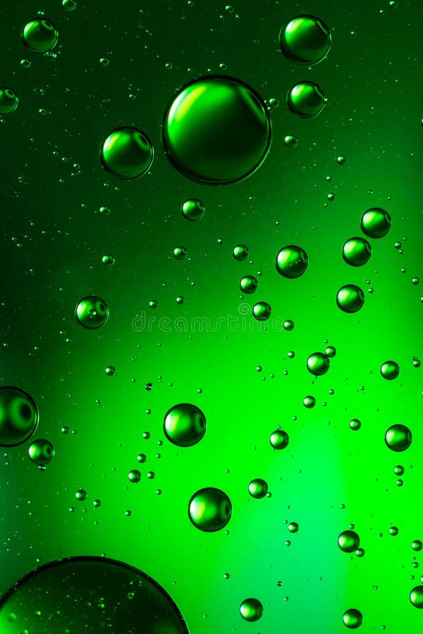 Oil and water, vivid green stock images
