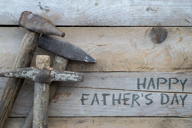 Fathers day concept, Wooden background with a hammer, home improvement concept. Fathers day concept, Wooden background with a hammer, home improvement concept