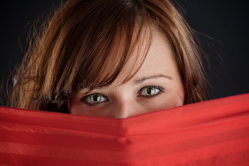 Ojos misteriosos de la mujer imagenes de archivo Ojos misteriosos de la mujer imagenes de archivo