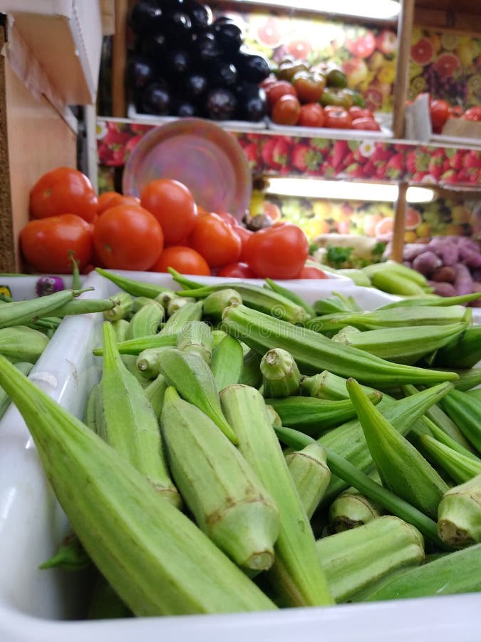 Okras tray in the shop stock photo. Image of tomato - 210634786