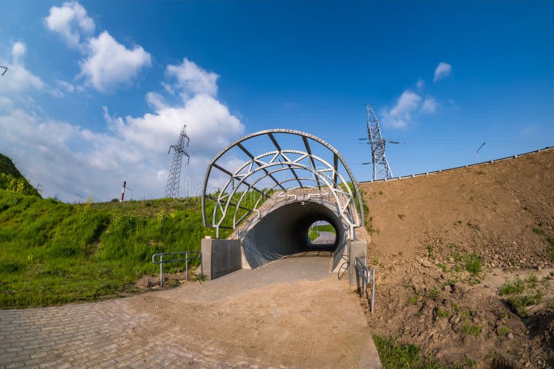 round tunnel footpath on blue sky background. round tunnel footpath on blue sky background.