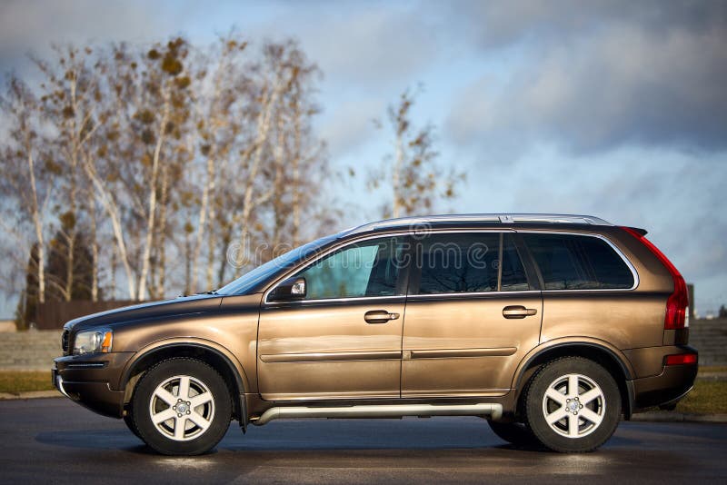 Berlin - October 2021:: Volvo XC90 2.5 1st generation Twilight Bronze 2002-20014 restyling 4WD 4wheel 4x4 SUV at spring forest road side view in the evening under cloudy sky, with copyspace. Berlin - October 2021:: Volvo XC90 2.5 1st generation Twilight Bronze 2002-20014 restyling 4WD 4wheel 4x4 SUV at spring forest road side view in the evening under cloudy sky, with copyspace.