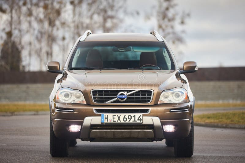 Berlin - October 2021:: Volvo XC90 2.5 1st generation Twilight Bronze 2002-20014 restyling 4WD 4wheel 4x4 SUV at spring forest road front view in the evening under cloudy sky, with copyspace. Berlin - October 2021:: Volvo XC90 2.5 1st generation Twilight Bronze 2002-20014 restyling 4WD 4wheel 4x4 SUV at spring forest road front view in the evening under cloudy sky, with copyspace.