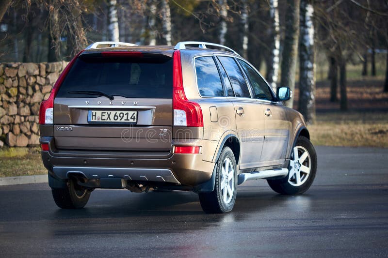 Berlin - October 2021:: Volvo XC90 2.5 1st generation Twilight Bronze 2002-20014 restyling 4WD 4wheel 4x4 SUV at spring forest road back three quarter view in the evening, with copyspace. Berlin - October 2021:: Volvo XC90 2.5 1st generation Twilight Bronze 2002-20014 restyling 4WD 4wheel 4x4 SUV at spring forest road back three quarter view in the evening, with copyspace.