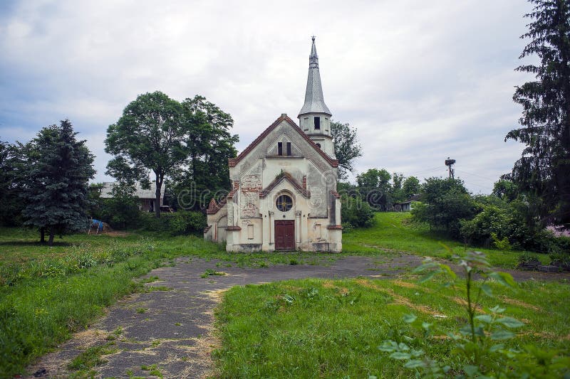 Old abandoned church against dramatic dark sky