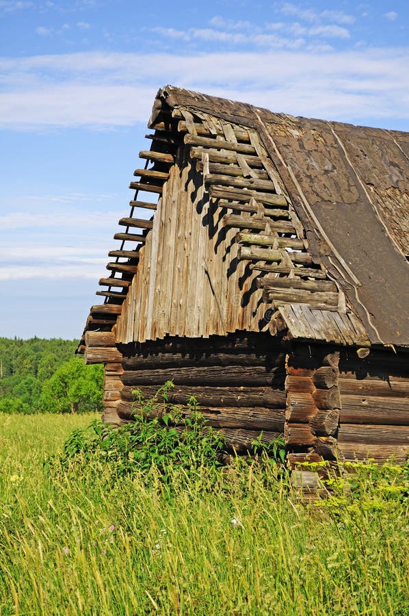 Old abandoned destroyed wooden barn