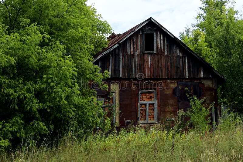 Old abandoned house in the forest. Small wooden house in the forest. Old boarded up house in the forest.
stock photo Old abandoned house in the forest. Small wooden house in the forest. Old boarded up house in the forest.
stock photo