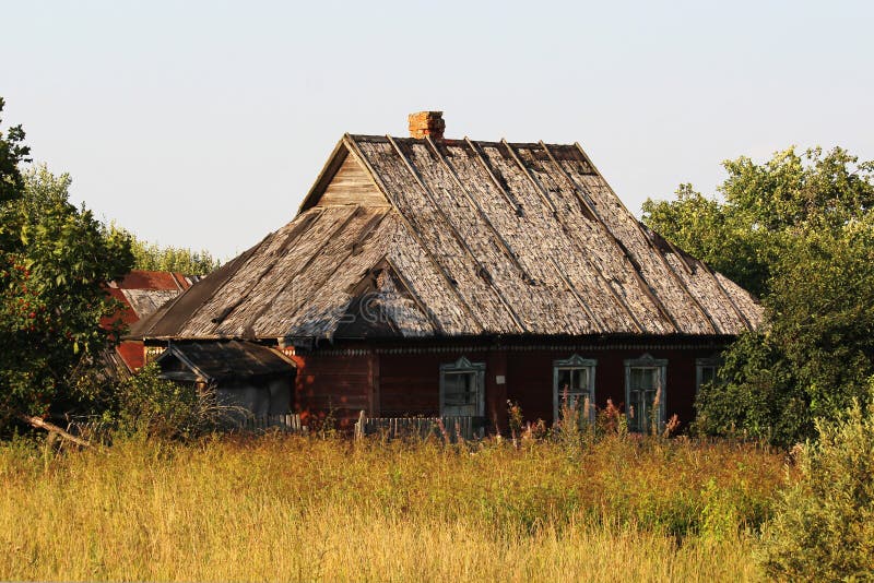 An old abandoned house in Russian countryside stock photo An old abandoned house in Russian countryside stock photo