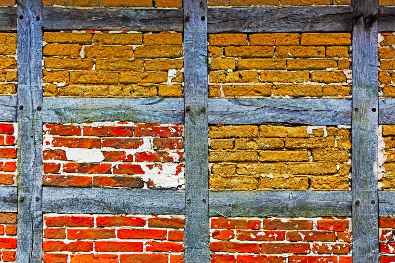 Old adobe and brick wall of half timbered house