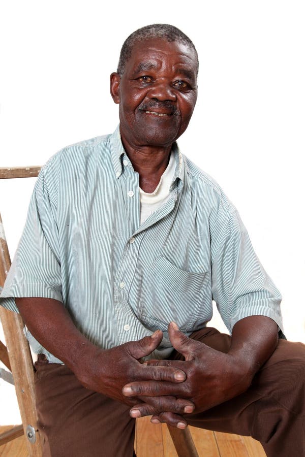 Old african man sitting on ladder