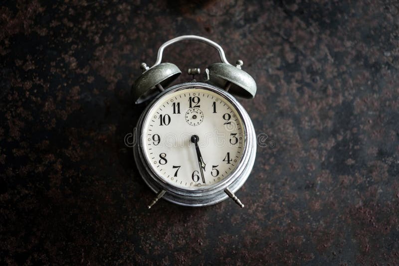 Old Alarm Clock on the Ancient Iron Table. Stock Image Image of