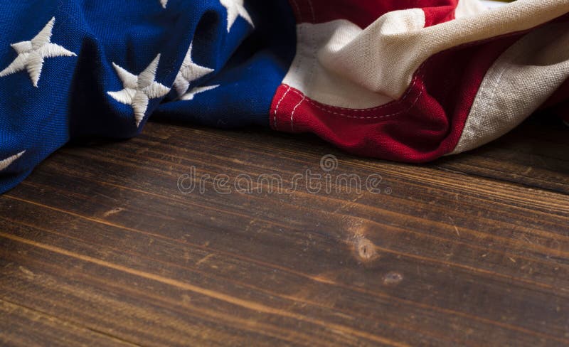 Old American Flag on wooden plank background stock photos Old American Flag on wooden plank background stock photos