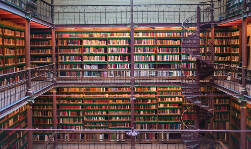 Old ancient library interior, ceiling books, windows, bookshelf royalty free stock photography