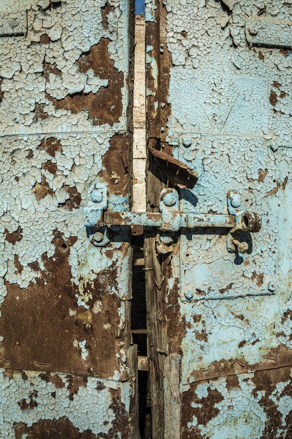 Old Antique Door with Chipped Paint and Rusted Lock. Stock Photo