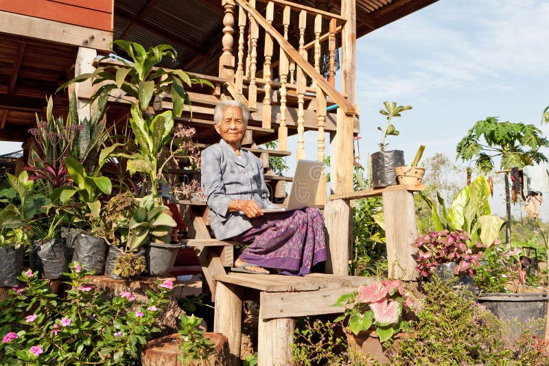 Old asian woman with laptop