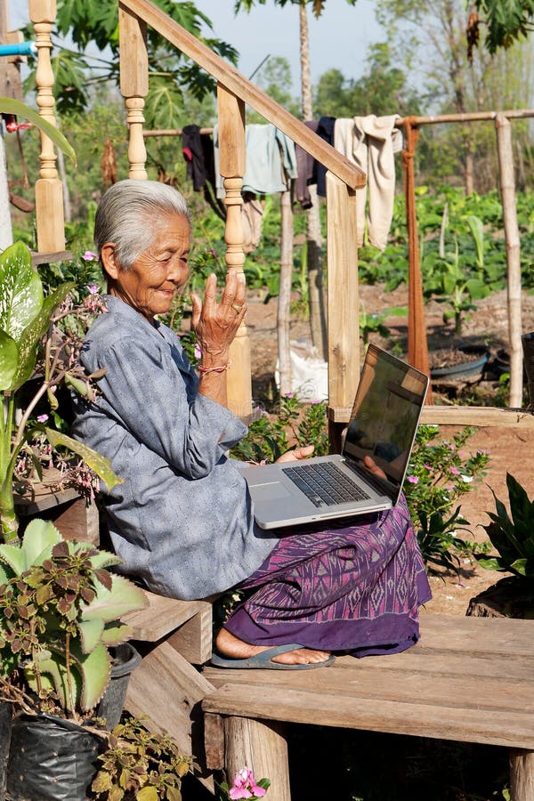 Old asian woman with laptop