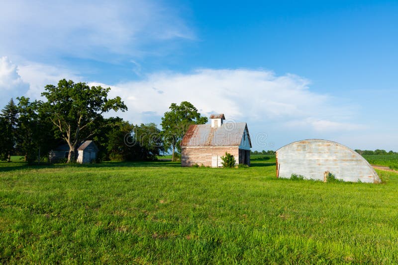 Old barn in grass field stock image. Image of architecture - 153415793