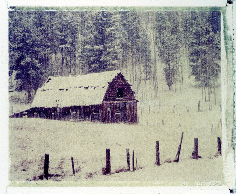 Old barn in snow storm