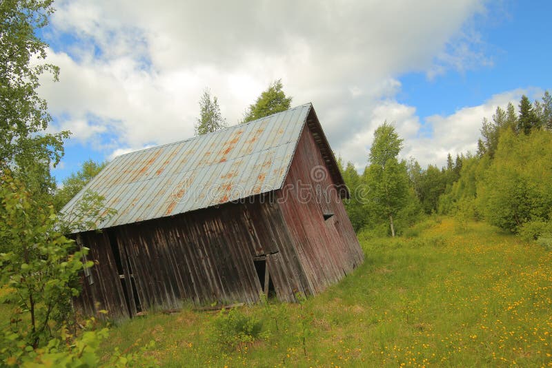 An old barn in Sweden, standing completely askew stock photography