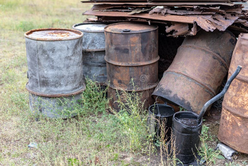 Old barrels for diesel. Metal containers for oil standing on the royalty free stock photos Old barrels for diesel. Metal containers for oil standing on the royalty free stock photos