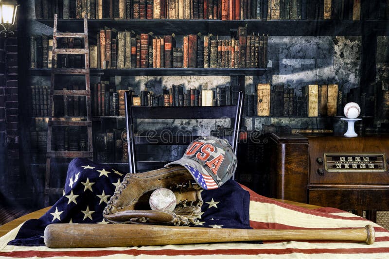 Old baseball glove and bat on American flag in retro library royalty free stock images