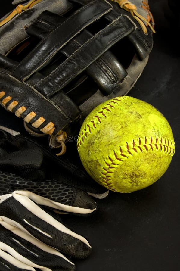 Old Baseball Glove With Yellow Softball And Batters Gloves