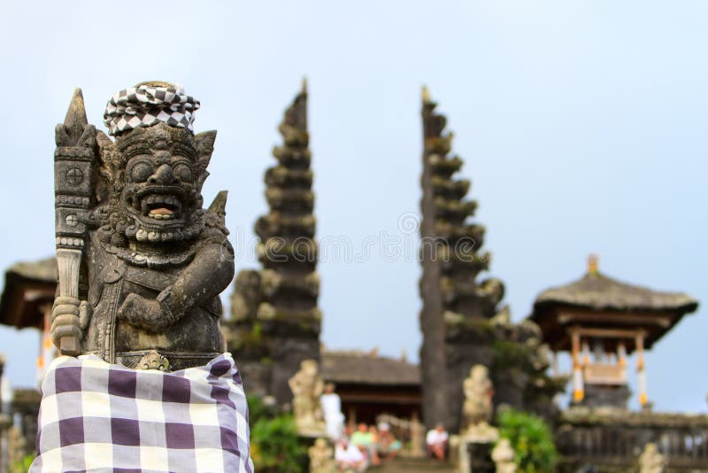 Old beautiful stone Balinese statue stock photography