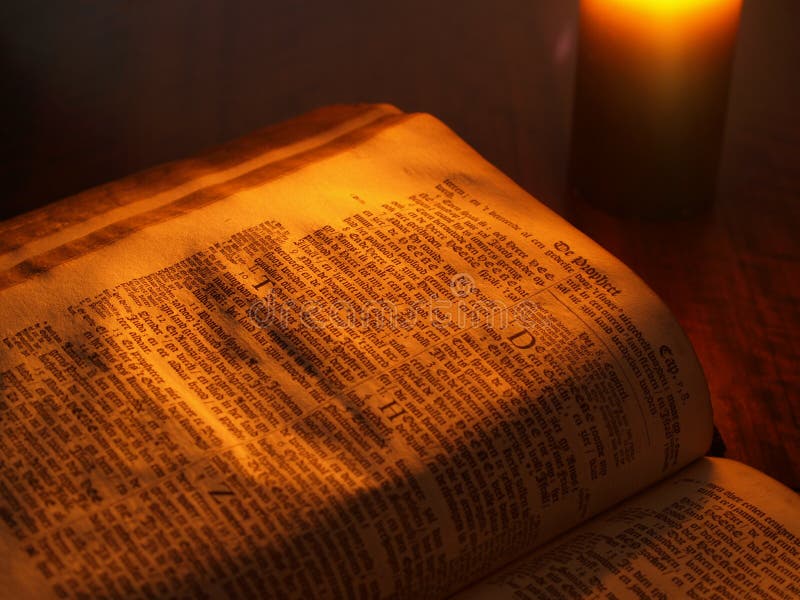 Old bible by candlelight