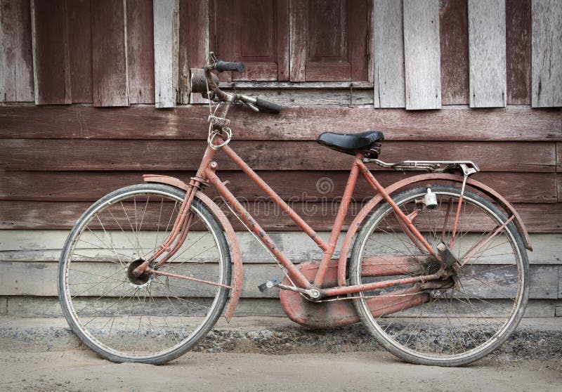 Old bicycle leaning against