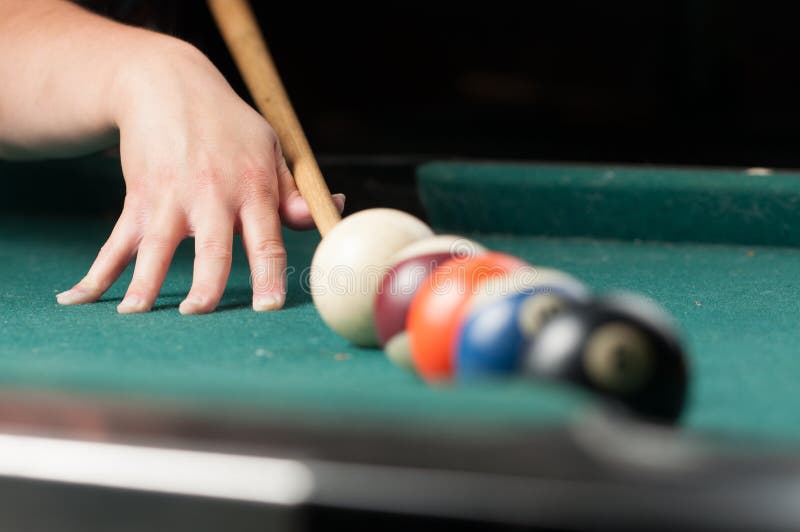Old Billiard Balls and Stick on a Green Table. Billiard Balls Isolated