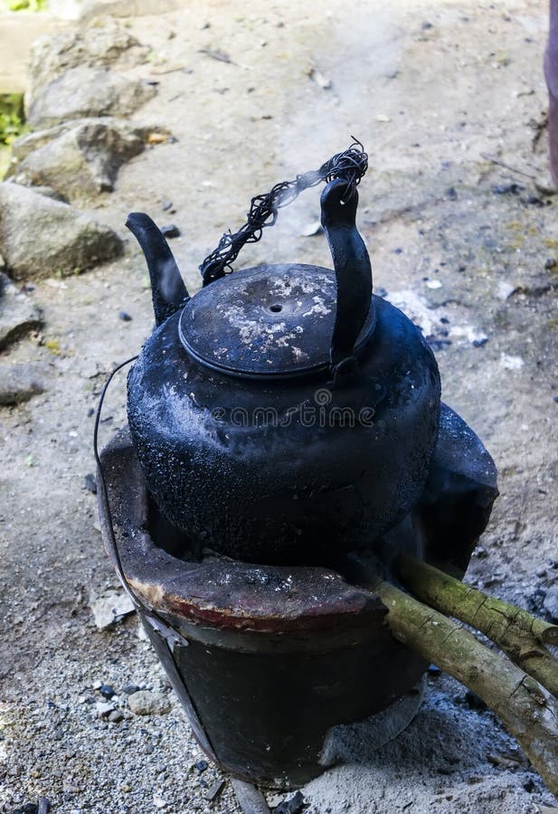 Old Black kettle on fire stock photo. Image of appliance 36872682