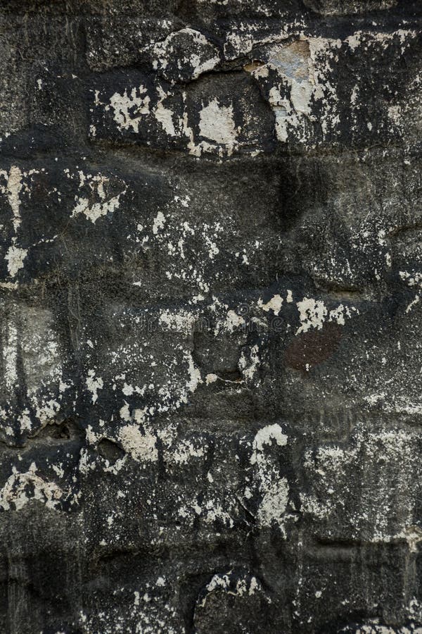 Old Black Wall with White Spots and Scratches. Stock Photo Image of